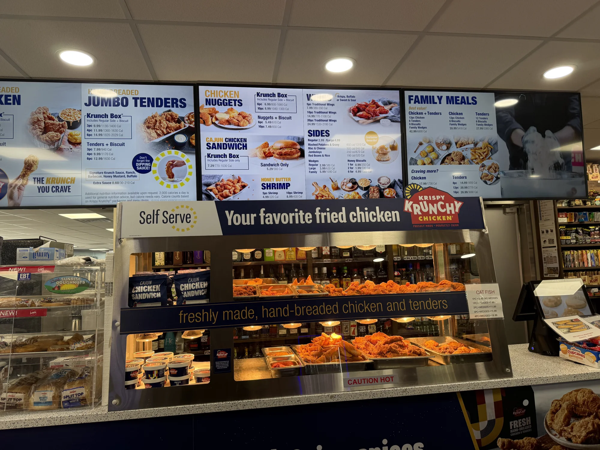 Arlene’s hot-food menu boards featuring chicken, tenders, family meals, and sides