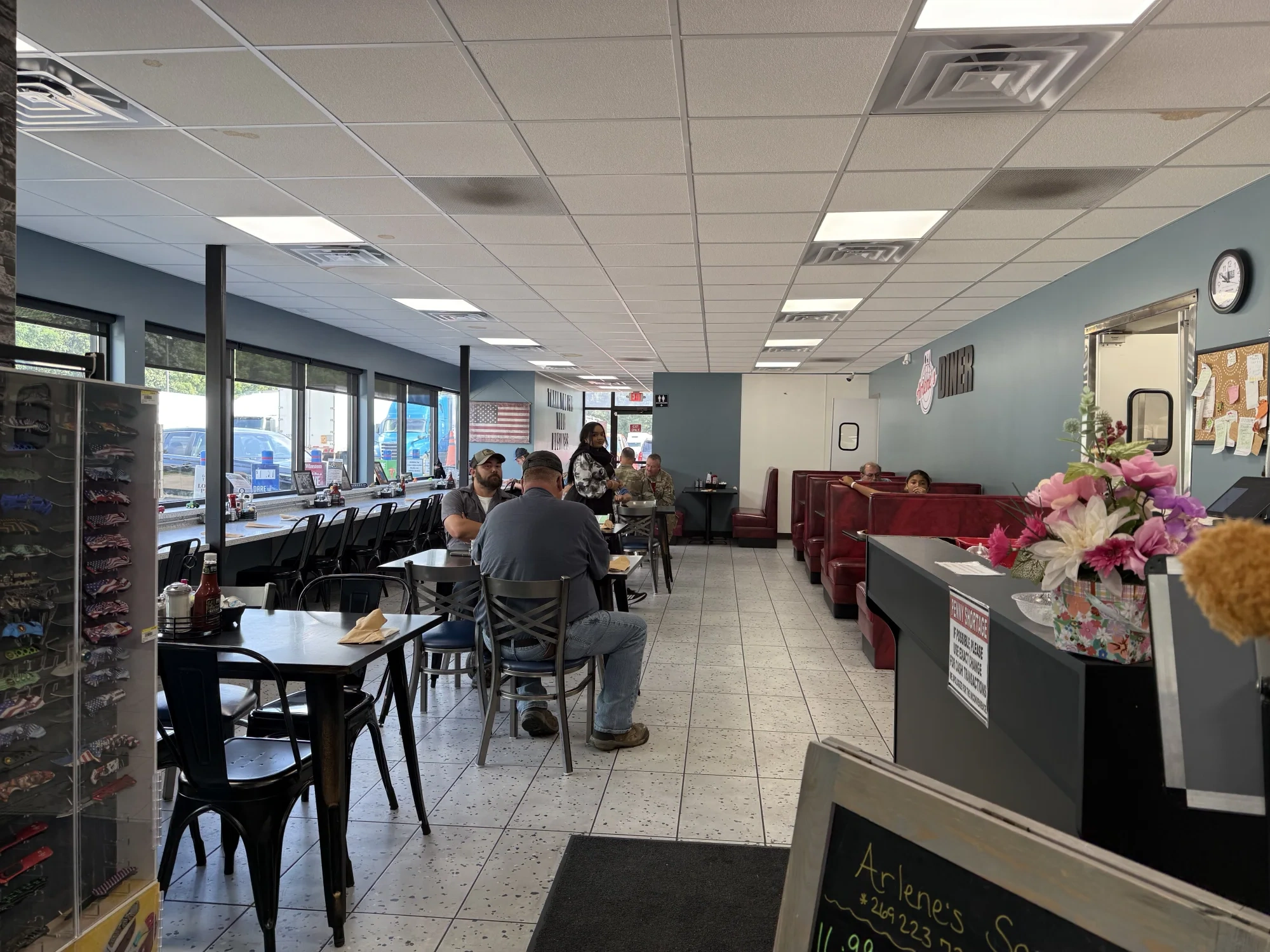 Arlene’s real dining room with counter seating, booths, and guests