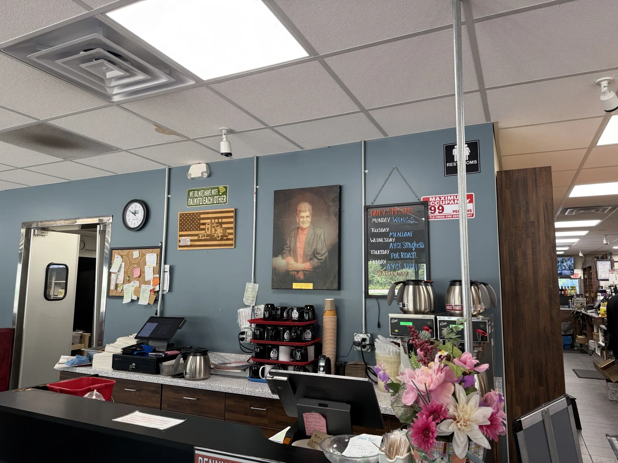 Arlene’s real service counter with coffee, daily specials, and the truck-stop dining room